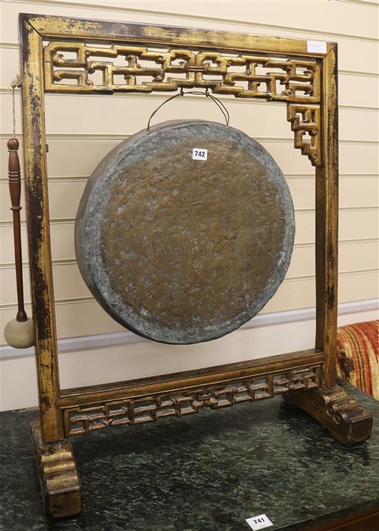 A Chinese gong on stand with a beater, H.90cm